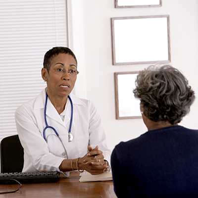 Doctor consulting her patient.